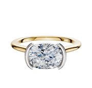 The 14K Two Tone Bezel Half Bezel East/West Cathedral Dome 1.5mm Engagement Ring features a modern cushion-cut diamond set in a stylish white metal setting, displayed against a plain white background.