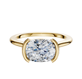 The 18K Yellow Gold Bezel Half Bezel East/West Cathedral Dome 1.5mm Engagement Ring showcases a round brilliant-cut diamond in a modern bezel setting with two curved prongs, displayed on a plain white background.