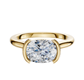An 18K yellow gold Bezel Half Bezel East/West Cathedral Dome 2.0mm engagement ring with a cushion-cut diamond, displayed on a plain white background.