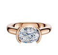 An 18K rose gold Bezel Half Bezel East/West Cathedral Dome 3.0mm engagement ring showcases a large oval-cut diamond held by two modern prongs, displayed against a plain white background.