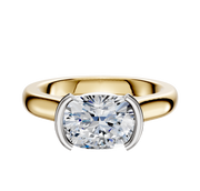 The 18K Two Tone Bezel Half Bezel East/West Cathedral Dome 3.0mm Engagement Ring features a wide gold band with a modern two-tone design and an elegant east/west bezel setting for your center stone.