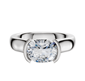 An 18K white gold engagement ring featuring a 4.0mm gemstone set east/west in a modern half-bezel cathedral dome setting, displayed against a white background.