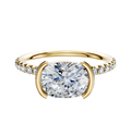 The 14K Yellow Gold Bezel Half Bezel East/West Classic Dome Engagement Ring features a 2.5mm band with one row of pave-set diamonds, showcasing a unique east/west bezel setting for a modern, elegant look.