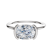 A 14K white gold engagement ring with a classic dome and 1.5mm band, featuring an east/west bezel half bezel setting, shown on a plain white background.