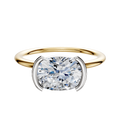 A 14K two-tone engagement ring with a classic dome design, featuring a 1.5mm band and an East/West half bezel setting for a modern look.