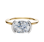 An 18K Two Tone Bezel Half Bezel East/West Classic Dome 1.5mm Engagement Ring is shown on a plain white background with a modern, round diamond in a contemporary setting.