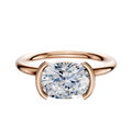 The 18K Rose Gold Bezel Half Bezel East/West Classic Dome 2.0mm Engagement Ring is shown on a plain white background, featuring a modern, minimalist setting with a brilliant round diamond.