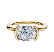 An 18K yellow gold Dome 2.0mm engagement ring featuring a classic half bezel east/west setting, offering simple elegance and highlighting the brilliance of your chosen center stone.