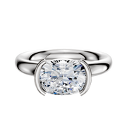 An 18K white gold half bezel east/west classic dome engagement ring, 3.0mm wide, features a modern minimalist setting with a cushion-cut diamond displayed against a plain white background.