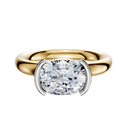 An 18K two-tone engagement ring with a 3.0mm classic dome band, featuring an East/West-set diamond in a half bezel setting.