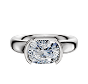 The 14K White Gold Bezel Half Bezel East/West Classic Dome 4.0mm Engagement Ring showcases a bold band and modern setting, elegantly displayed against a plain white background.