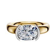 An 18K Two Tone Bezel Half Bezel East/West Classic Dome 4.0mm Engagement Ring is featured, showcasing a modern two-tone design in a sleek dome style, set against a plain white background.