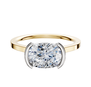 A 14K two-tone bezel half bezel East/West cathedral flat 1.5mm engagement ring, elegantly displayed on a plain white background.