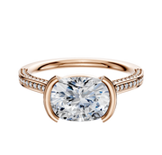 An 18K rose gold engagement ring featuring a bezel and half bezel east/west cathedral setting with a flat band, adorned with three rows of pavé diamonds and measuring 2.0mm wide.