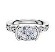 The 14K Two Tone Bezel Half Bezel East/West Classic Flat 1-Row-Pave 2.5mm Engagement Ring features a classic design with a central diamond set east-west in a half bezel, accented by a row of pave-set diamonds along the flat band.