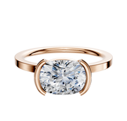 A 14K rose gold Bezel Half Bezel East/West Classic Flat 1.5mm engagement ring is displayed on a plain background.