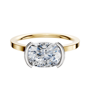 An 18K two-tone bezel half bezel East/West classic flat 1.5mm engagement ring photographed against a plain white background.