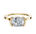 An 18K Yellow Gold Bezel Half Bezel East/West Classic Flat 1.5mm Engagement Ring is displayed on a plain background.