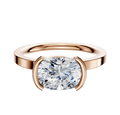 An 18K rose gold Bezel Half Bezel East/West Classic Flat 2.0mm engagement ring displayed against a plain, light background.
