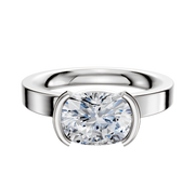 The 14K White Gold Bezel Half Bezel East/West Classic Flat 3.0mm Engagement Ring features a modern, cushion-cut design with a minimalist bezel setting, shown on a plain white background.