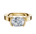 A 14K yellow gold Bezel Half Bezel East/West Classic Flat 3.0mm engagement ring with a wide band and cushion-cut diamond, shown against a plain white background.
