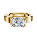 A 14K yellow gold engagement ring with a classic flat 4.0mm band features a bezel half-bezel east/west–set stone, displayed against a plain white background.