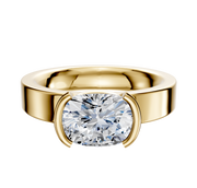 A 14K yellow gold engagement ring with a classic flat 4.0mm band features a bezel half-bezel east/west–set stone, displayed against a plain white background.
