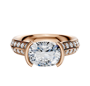 The 18K Rose Gold Bezel Half Bezel East/West Cathedral Knife Edge 1-Row-Pave 2.5mm Engagement Ring features a unique east/west cathedral design with a single row of pave diamonds set in a rose gold band.