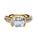 An 18K yellow gold East/West cathedral engagement ring with a bezel-set center stone and a single row of pave diamonds along the knife-edge band, shown against a white background.