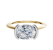 A 14K two-tone bezel half bezel East/West cathedral knife edge 1.5mm engagement ring is displayed on a plain white background.