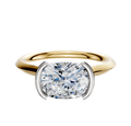 A 14K two-tone bezel half bezel East/West cathedral knife edge 2.0mm engagement ring set against a plain white background.