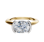 The 18K Two Tone Bezel Half Bezel East/West Cathedral Knife Edge 2.0mm Engagement Ring features a large round diamond in a unique four-prong white metal setting, shown against a plain white background.