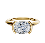 A 14K yellow gold cathedral knife edge engagement ring with a 2.0mm band and a bezel half bezel east/west setting, displayed against a plain white background.