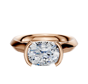 An 18K rose gold Bezel Half Bezel East/West Cathedral Knife Edge 3.0mm engagement ring with a cushion-cut diamond, showcased on a plain white background.