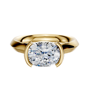 A 14K yellow gold bezel half bezel east/west cathedral knife edge 3.0mm engagement ring showcased against a white background.