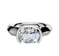 An 18K white gold knife edge engagement ring with a wide band and half bezel east/west cathedral setting, showcasing a 4.0mm cushion-cut clear gemstone, displayed against a plain white background.