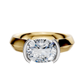 An 18K two-tone engagement ring with a 4.0mm wide knife edge band and an east/west cathedral setting in a modern half bezel style.