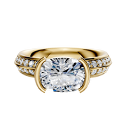 A 14K yellow gold east/west classic knife edge engagement ring featuring a half bezel setting and a single row of pave diamonds along the 2.5mm band.