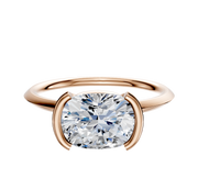 A 14K rose gold engagement ring featuring a bezel half bezel east/west classic knife edge 1.5mm band, displayed against a plain white background.