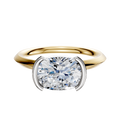 A 14K two-tone engagement ring featuring a half bezel east/west classic knife edge 2.0mm band, displayed against a plain white background.