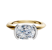 An 18K two-tone bezel half bezel east/west classic knife edge 2.0mm engagement ring shown against a plain white background.
