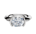 An 18K white gold engagement ring with a 3.0mm knife edge band in a classic east/west half bezel setting, displayed against a plain white background.