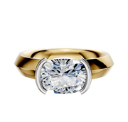 An 18K two-tone bezel half bezel East/West classic knife edge 4.0mm engagement ring is shown against a plain white background, featuring a modern design with a striking, thick band and elegant setting.