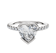 The 18K White Gold Bezel Half Bezel East/West Classic Dome 1-Row-Pave 2.5mm Engagement Ring showcases a sparkling central diamond and a sleek band accented with a row of small pavé diamonds, offering classic elegance against a white background.