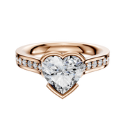 An 18K Rose Gold Bezel Half Bezel East/West Cathedral Flat 1-Row-Pave 2.5mm Engagement Ring with a heart-shaped center diamond and small round diamonds set along the band, displayed on a white background.