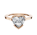 The 14K Rose Gold Bezel Half Bezel East/West Cathedral Flat 1.5mm Engagement Ring is showcased with a striking, heart-shaped diamond centerpiece against a clean white background.
