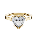 An 18K yellow gold Bezel Half Bezel East/West Cathedral Flat 2.0mm engagement ring with a large heart-shaped clear diamond, showcased against a plain white background.