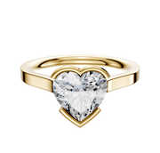 An 18K yellow gold Bezel Half Bezel East/West Cathedral Flat 2.0mm engagement ring with a large heart-shaped clear diamond, showcased against a plain white background.