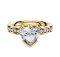 An 18K yellow gold engagement ring featuring a classic flat band with half bezel and east/west setting, accented by a single row of 2.5mm pave diamonds.