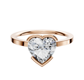 A 14K rose gold engagement ring with a classic flat 1.5mm band and an east/west half bezel setting, displayed against a plain white background.